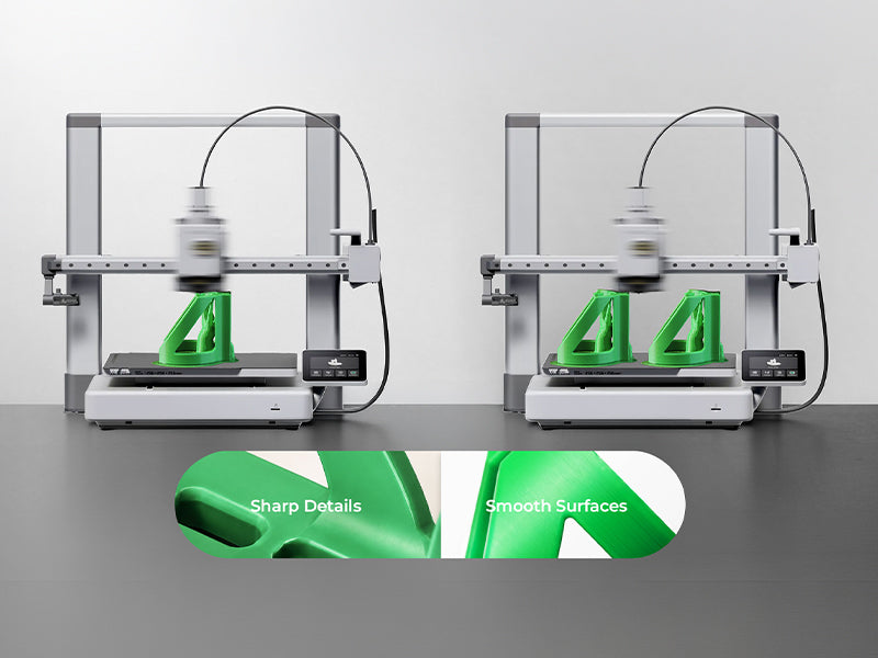 Two 3D printers producing green PETG parts with detailed surfaces