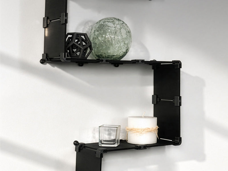 3D printed PETG wall brackets holding household objects